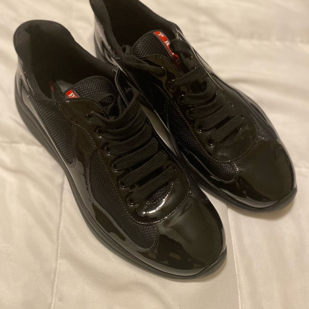 Prada mens shoe size Prada 10.5 which is an 11/11.5 US. All Black with red